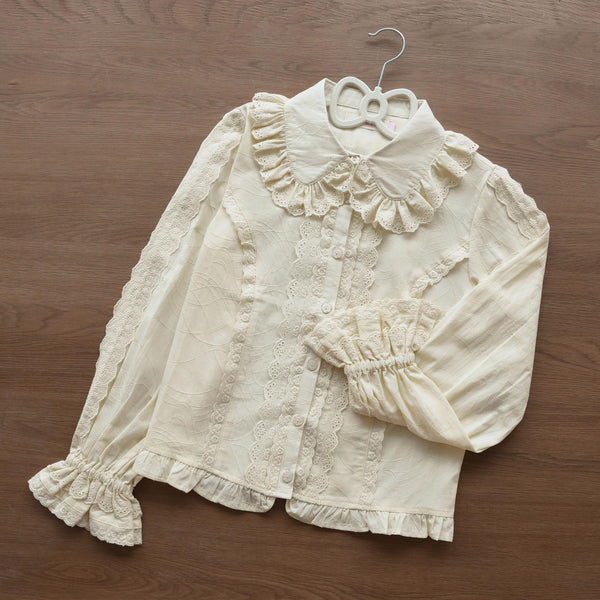 Blue Lolita blouse with a doll collar, lace trim, front pleats, and bubble sleeves.