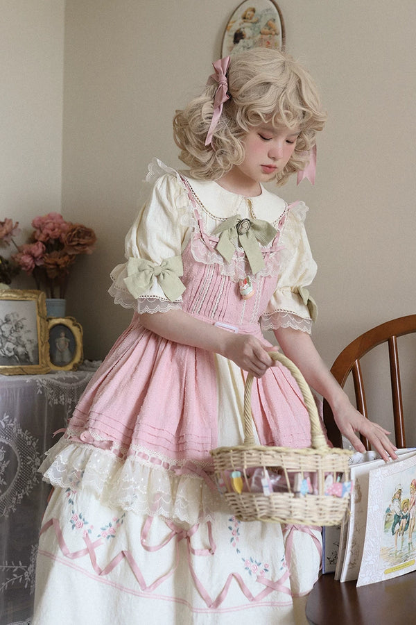 Long cotton OP dress with floral embroidery and lace trim styled in a pastoral room.