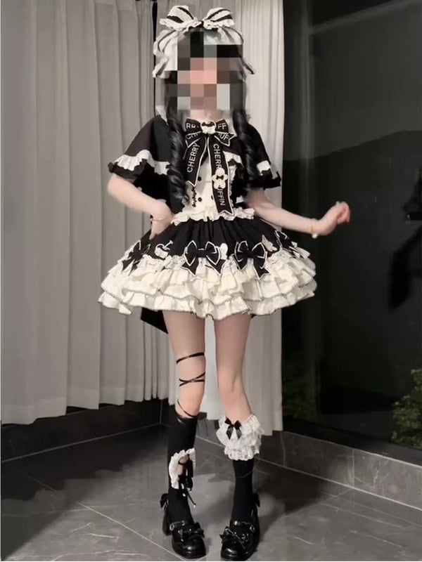 Creamy black and white Lolita dress set with cape, train, bows and accessories