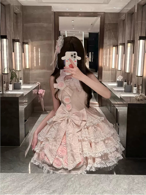 Pink Lolita dress with rose appliqués, a large bow and layered lace skirt