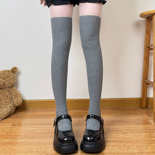 Oatmeal ribbed over-the-knee socks worn with a brown-and-plaid Lolita coordinate.