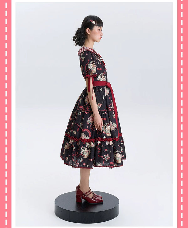 Black and ivory printed OP dresses with red trim and full skirts