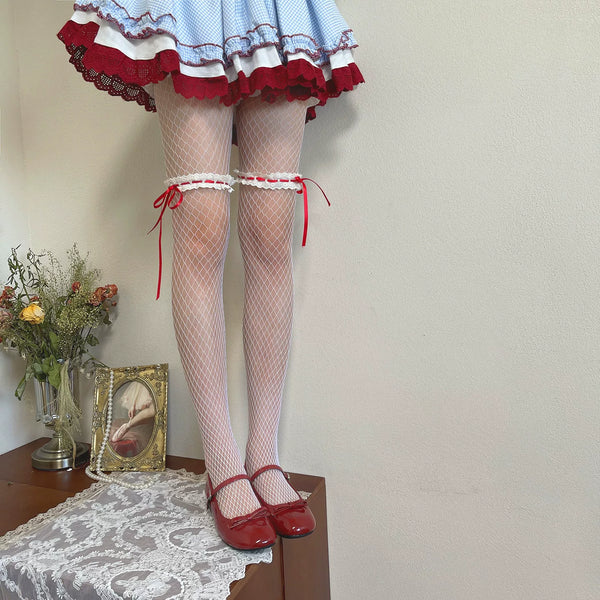 White fishnet pantyhose with red lace ribbon bands styled with a blue gingham skirt and red Mary Jane shoes.