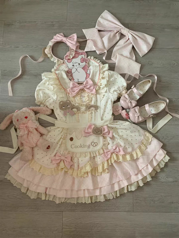 Pink and cream bear-themed Lolita OP dress set with apron, bows, and layered ruffles