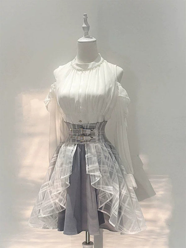 White off-shoulder top and paneled short skirt set on a dress form