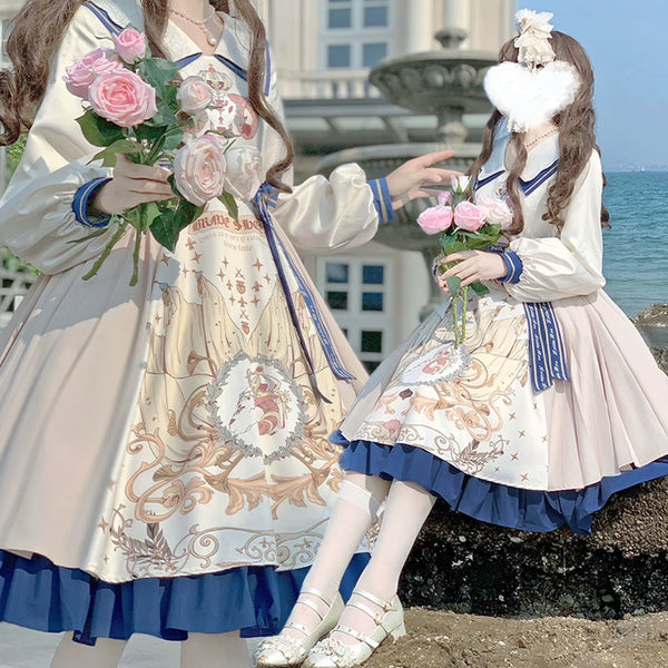 Baozi Pig cream one-piece dress with printed panel and blue ruffled hem