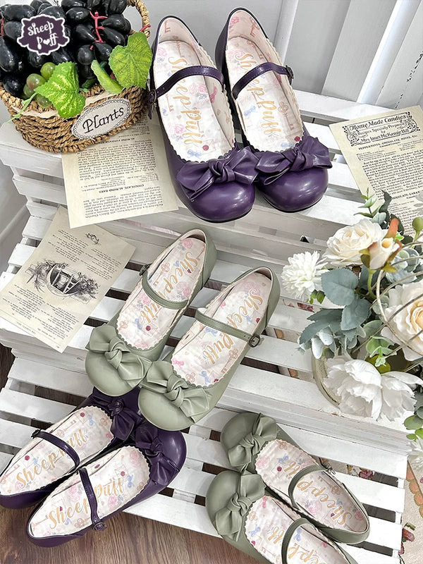 Sheep Puff rounded bow grape Mary Jane shoes featuring classic black patent leather with a decorative bow and strap closure.