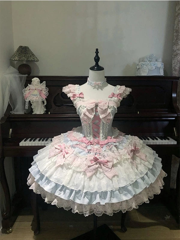 Blue-and-pink lace-trimmed JSK dress with bows and a full layered skirt displayed on a mannequin.