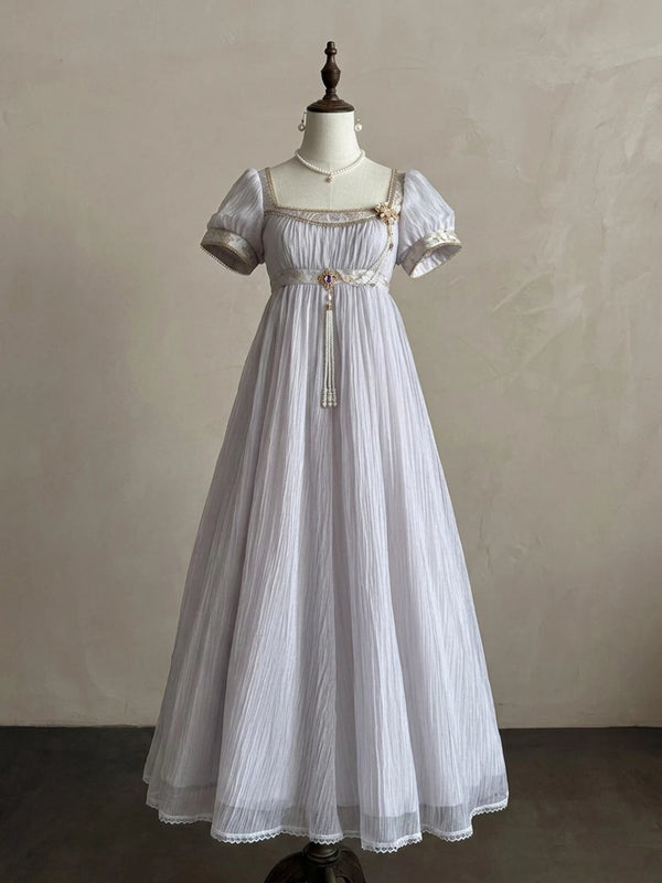 Purple empire-style dress with gold trim displayed on a mannequin, front and back views.