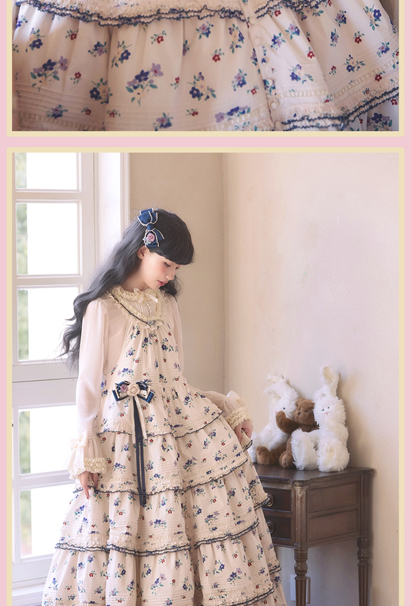 Cream floral Lolita dress on a hanger with navy-edged frills