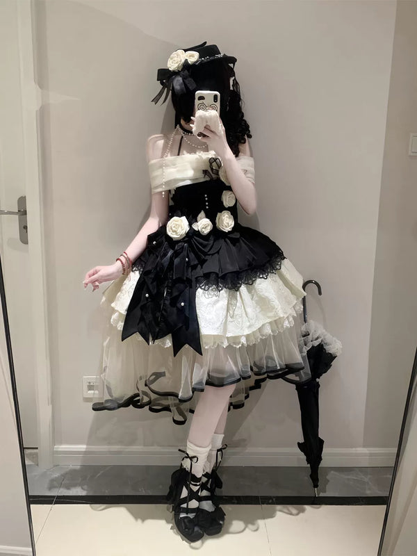 Creamy black-and-ivory halter OP dress set with a layered skirt and ivory rose accents