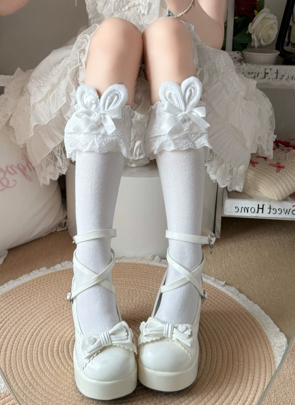White lace socks with bunny-ear cuffs and pink bows