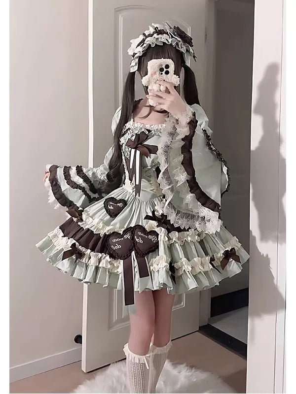 Mint-and-chocolate Lolita JSK set with hime sleeves and floral headpiece worn in a mirror photo