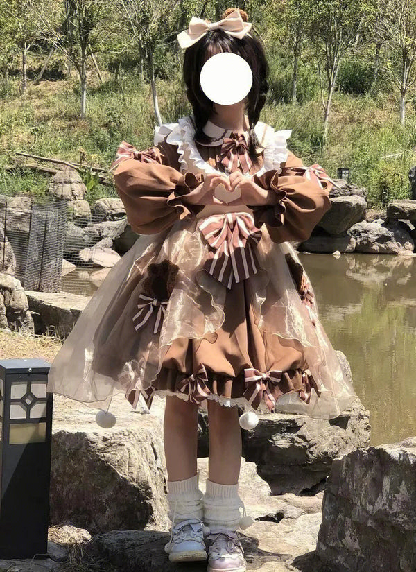 Brown ruffled one-piece dress with layered bows shown from front and back outdoors