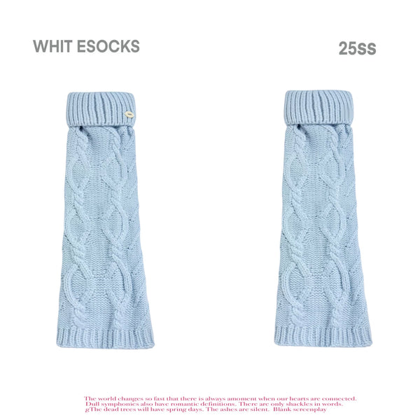 Baby blue and grey cable-knit turn-cuff leg warmers shown with flats.