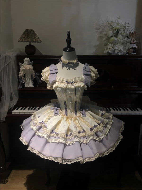 Lavender-and-ivory layered Lolita dress with lace ruffles and lavender bows displayed on a mannequin.