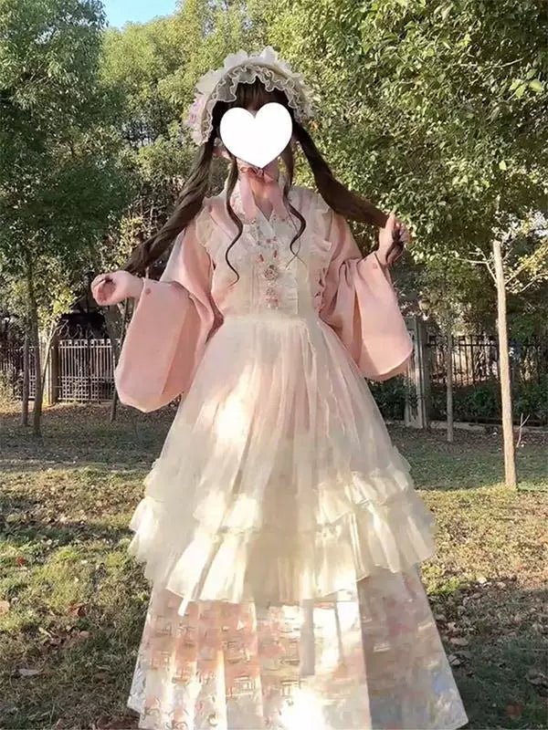Pink Ming-style top and mamian skirt set with apron, worn outdoors.