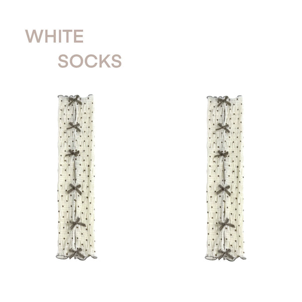 Cream sock covers with brown polka dots, bows and cutout panels shown in two worn configurations.