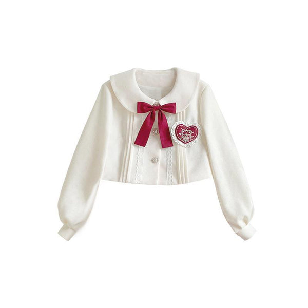 White short coat with a red bow and heart detail on a white background