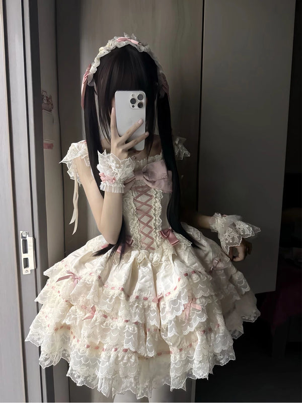 Apricot JSK dress with layered lace and pink bows in a mirror photo