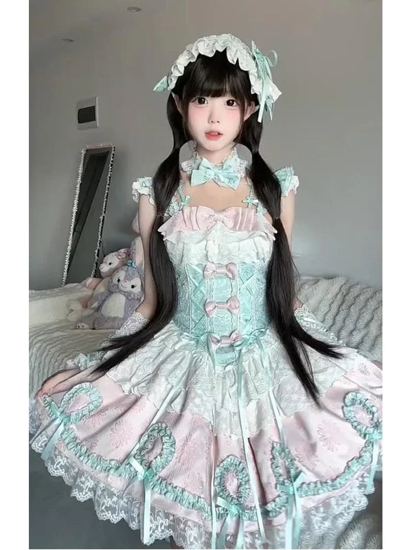Model wearing a mint-pink ballet-inspired JSK with lace layers and matching accessories.