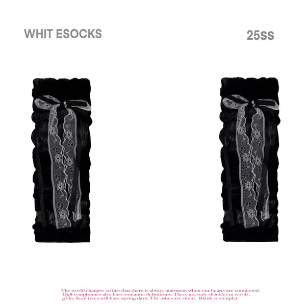Close-up styling of thin gathered socks with vertical stripe texture and ribbon ties.