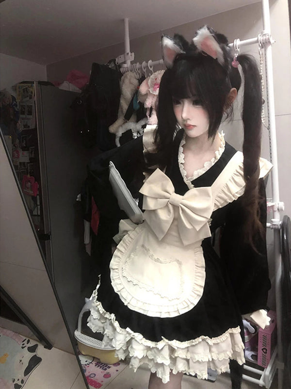 Creamy black-and-white maid OP dress with oversized bow and apron