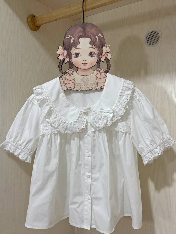 White cotton short-sleeve Lolita blouse with a broad lace collar and gathered lace-trimmed cuffs.