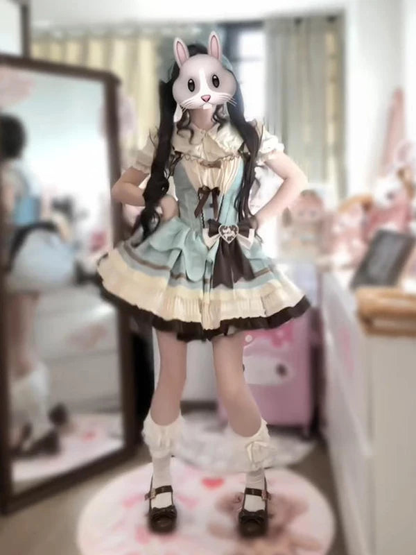 Mint-and-cream JSK set with brown bow, ruffle trim and short-sleeve shirt shown in a full outfit view.