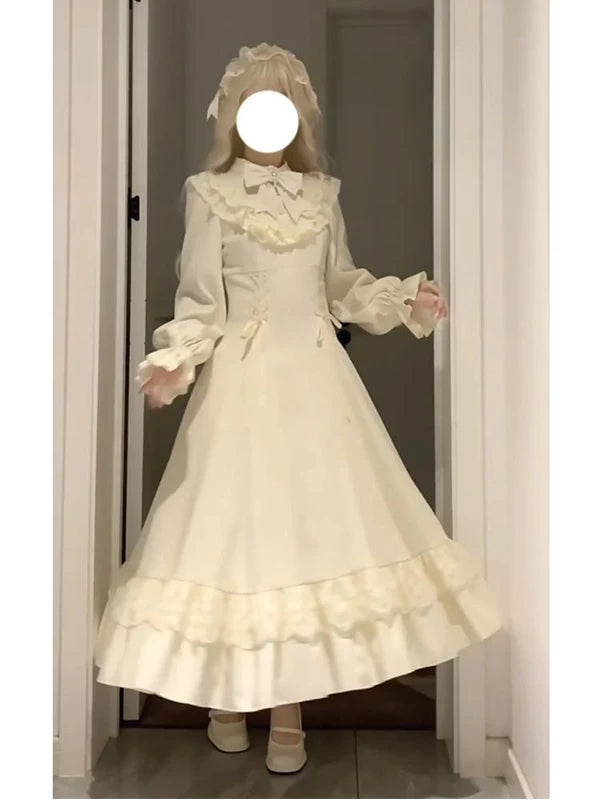 Creamy ivory White Moonlight long-sleeve dress with ruffled shawl collar and tiered hem