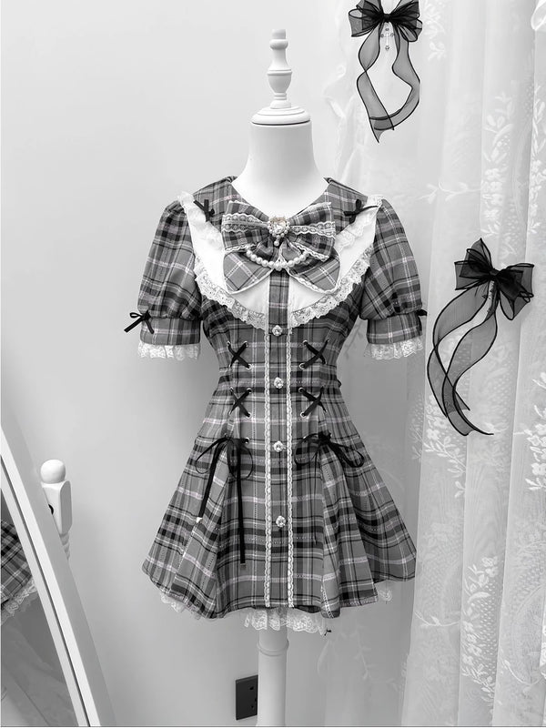 Front view of gray gothic lolita three-piece dress set with plaid pattern, lace trim, and bow accent