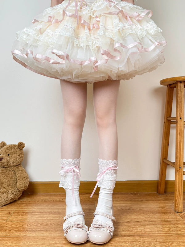 Chubby Bear Tales white lace socks with pink ribbons styled on a model.