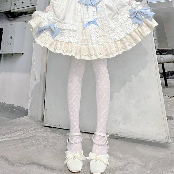 White heart-patterned pantyhose with diagonal stripe details and white Mary Jane shoes.