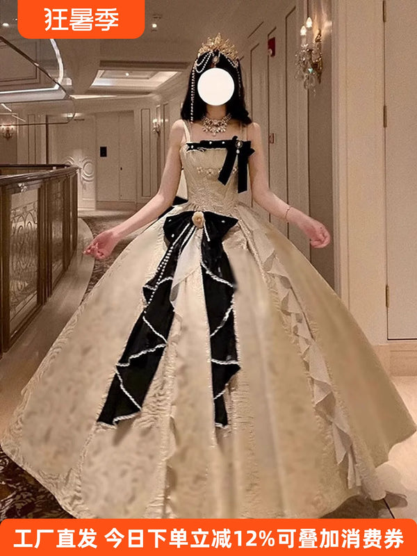 Champagne and black Gothic Lolita ballgown with sweetheart neckline and voluminous floor-length skirt