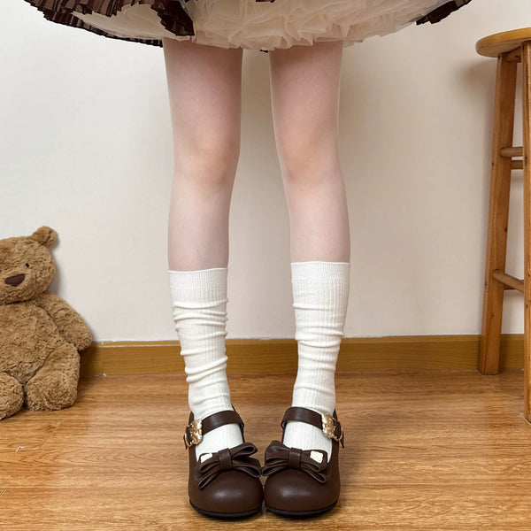 Brown gathered slouch socks worn with a plaid Lolita skirt and Mary Jane shoes.