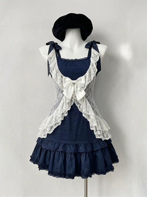 Navy and white sweet lolita 3-piece coord set with lace cardigan, bow camisole top, and tiered ruffled mini skirt on a mannequin