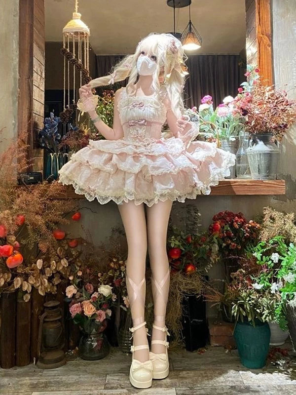 Creamy pink tiered JSK with lace trim styled in a floral interior