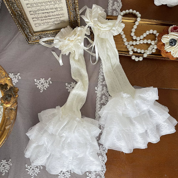 Cream cutout tights and lace stocking covers styled with a layered cream Lolita outfit.