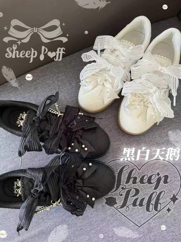 Black and white Swan Lolita sneakers by Sheep Puff featuring sheep puff detail and stylish design for casual wear.