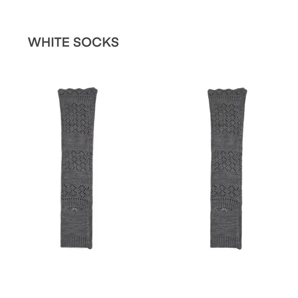 Grey openwork knit leg warmers with lace-edged cuffs styled with silver pointed shoes.