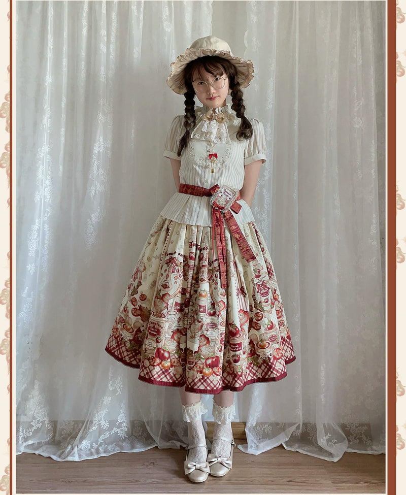 Red-and-cream tomato-print Lolita dress with gingham accents styled on a model.
