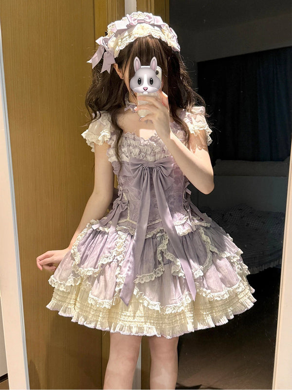 Purple Creamy Lolita dress with layered lace, a large bow and a full skirt