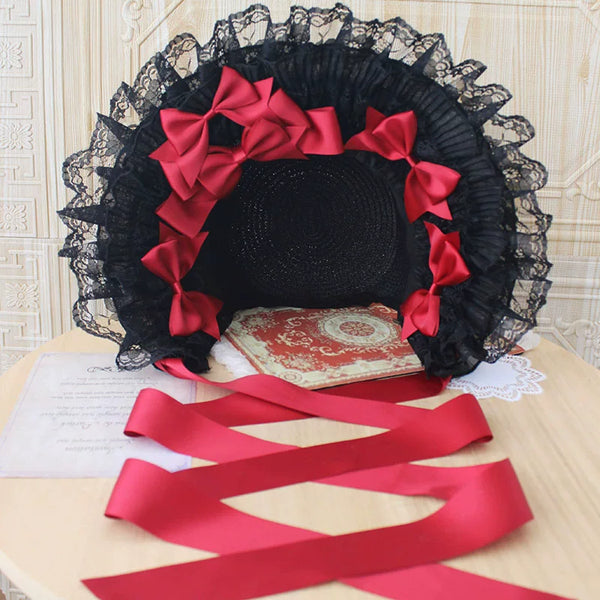 Black lace Lolita flat hat with ribbon bows shown in cream and black colourways.