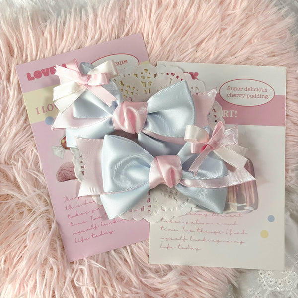 Blue and pink layered bow hair clip with ribbon tails