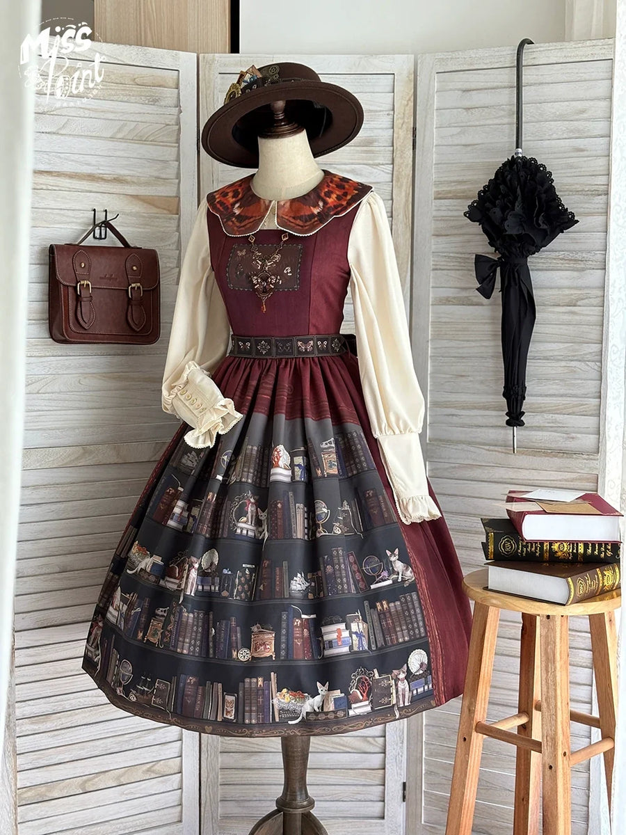 Burgundy Miss Point German Bookshelf Lolita JSK displayed with a cream blouse