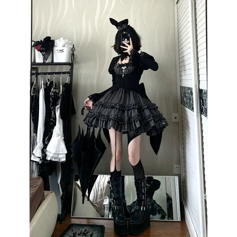 Black Kuro Lolita one-piece dress with long sleeves and a tiered pleated skirt