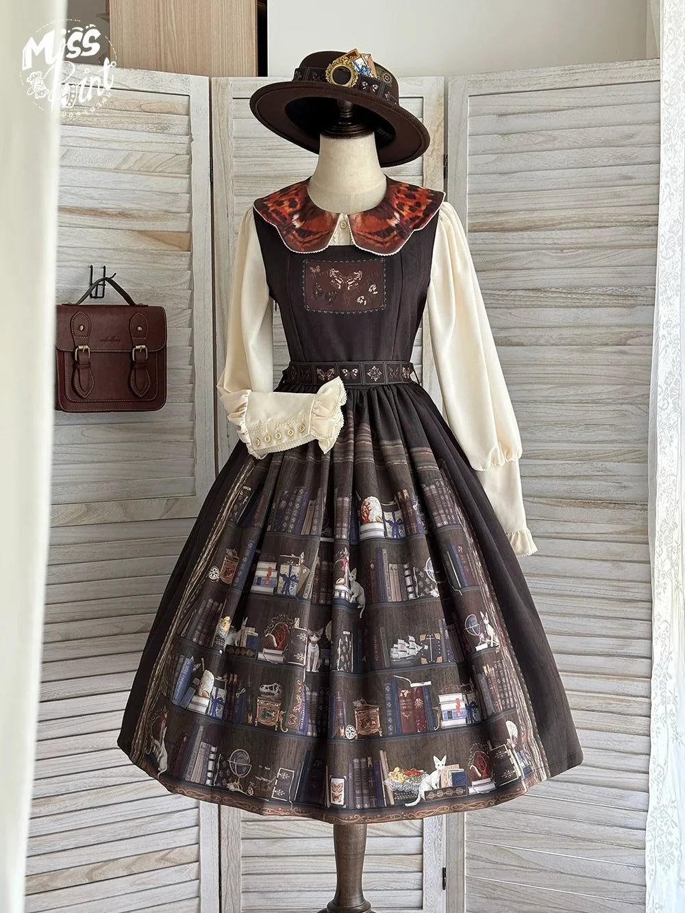 Dark brown Miss Point German Bookshelf JSK with a cream blouse and printed book motif skirt