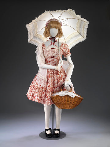A red and cream Innocent World Lolita ensemble with parasol and basket