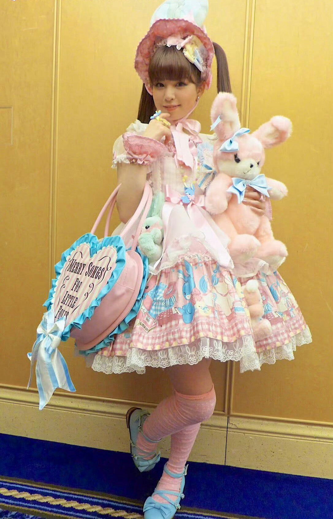 Lolita model in a pink-and-blue coordinate with plush rabbits
