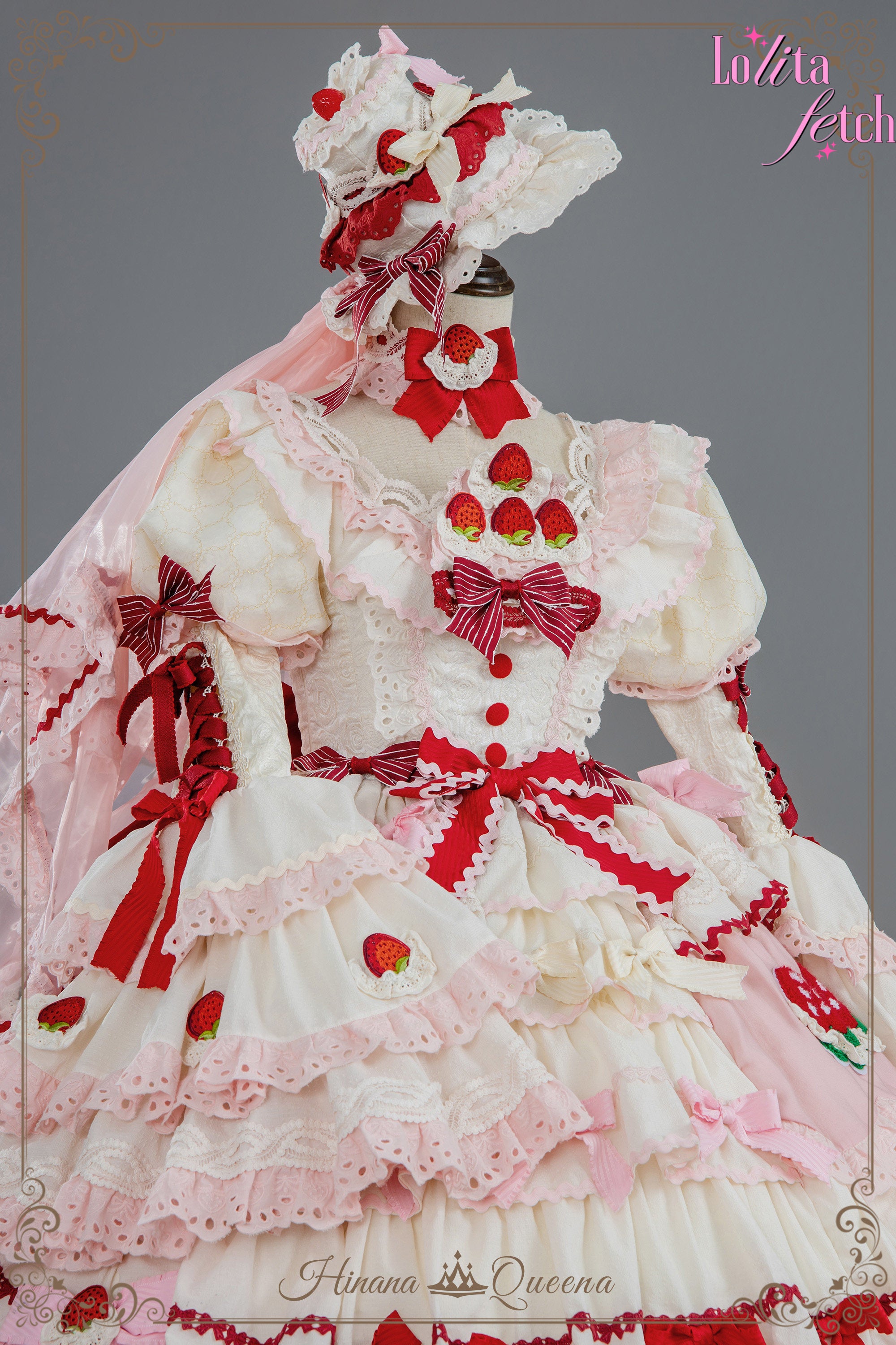 Strawberry Party Lolita dress by Lolita Fetch featuring a floral JSK and OP in a pastel pink and red strawberry print.